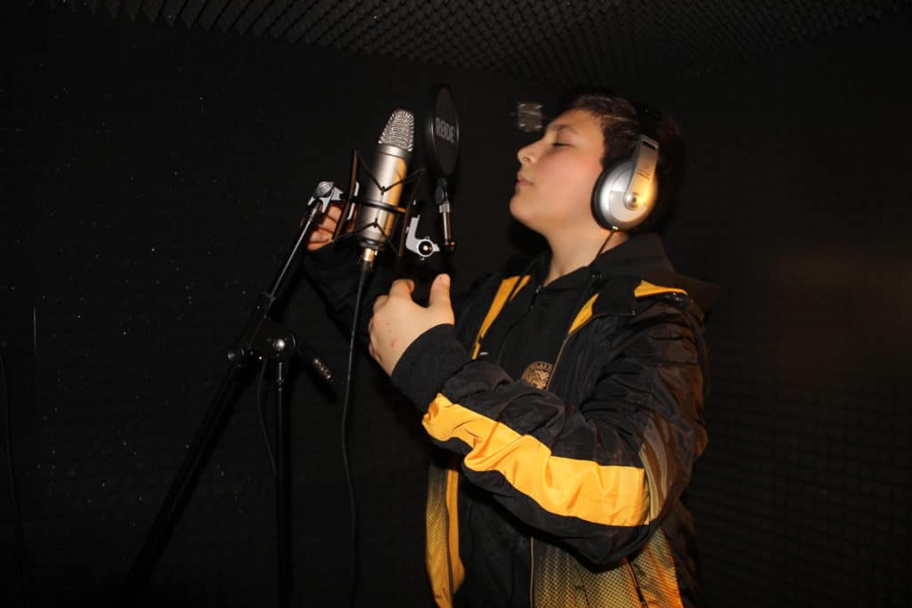 Workshop attendee recording vocals